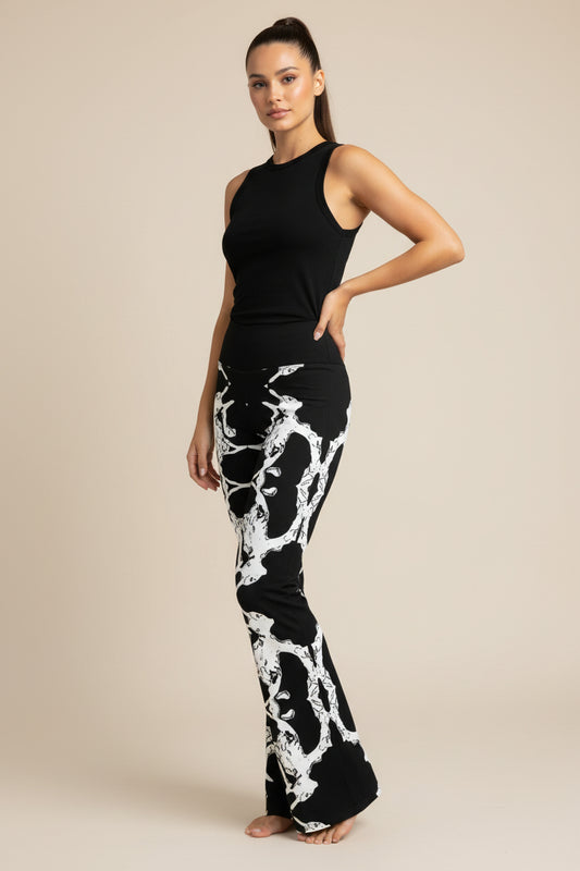 Abstract Flare Leggings: Black and White High-Waisted Trousers