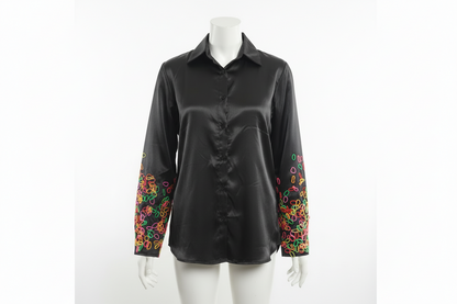 Long sleeved shirt with playful abstract pattern on sleeve.