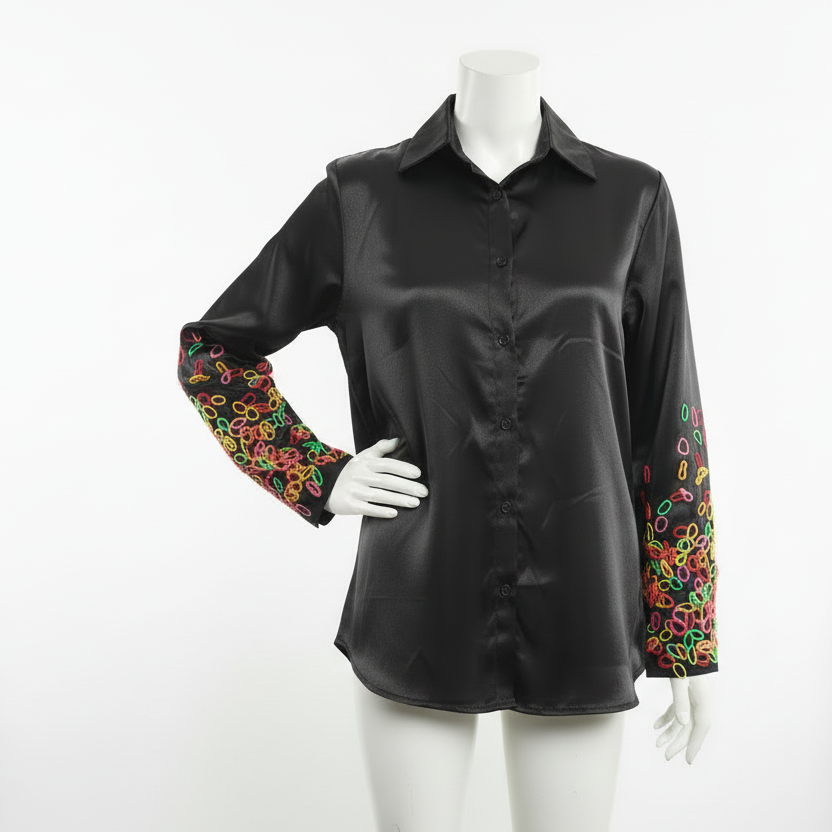 Long sleeved shirt with playful abstract pattern on sleeve.
