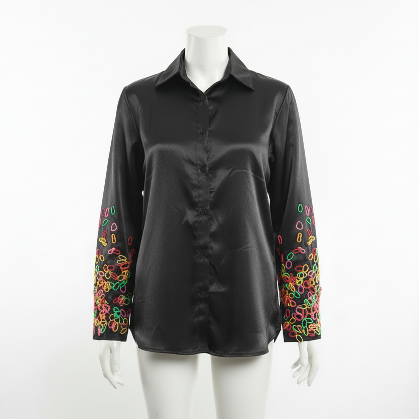Long sleeved shirt with playful abstract pattern on sleeve.